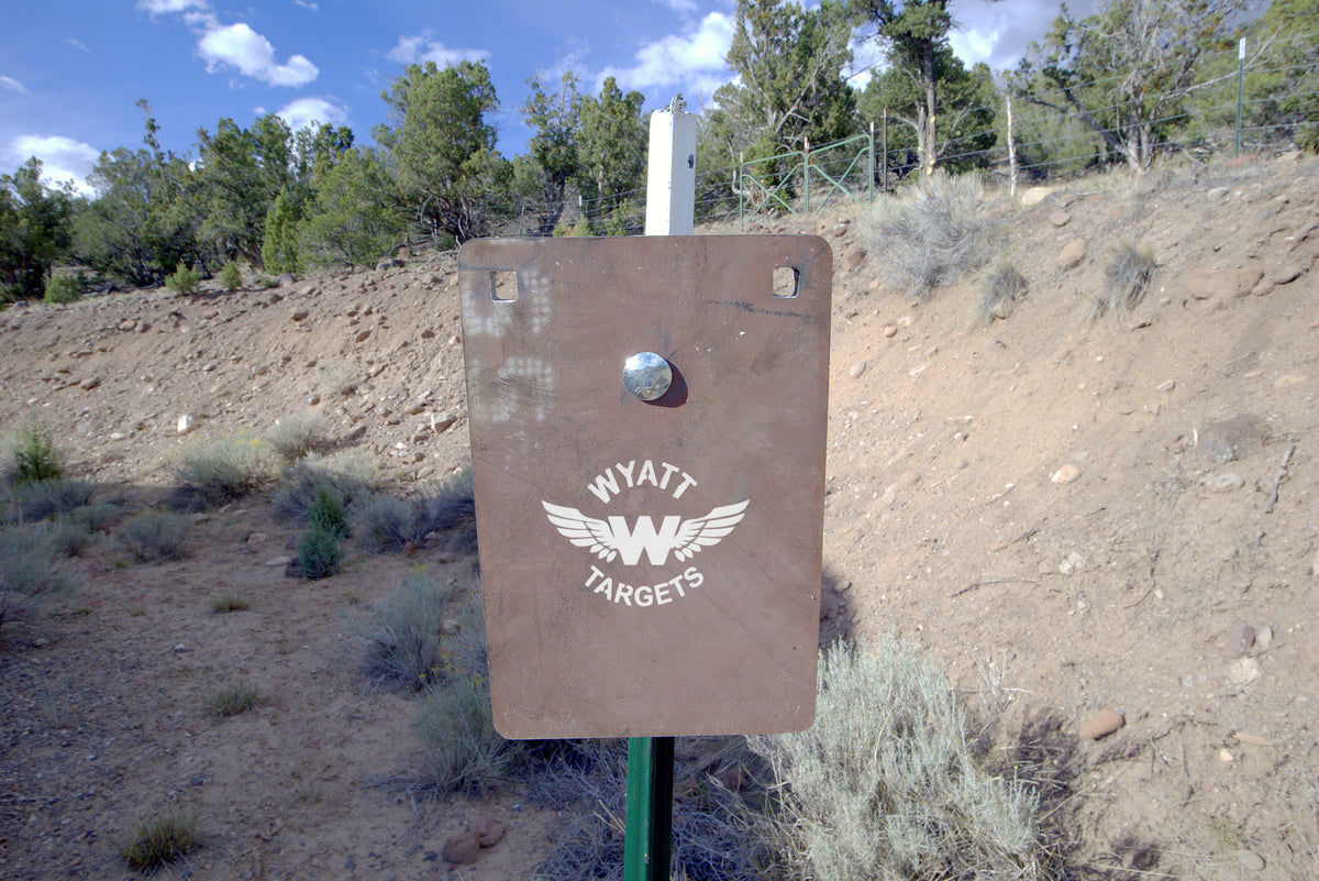 8 x 12-inch Surface Rust AR500 plate on a T-post at the range