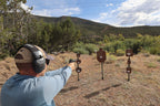 Shooter hitting Wyatt Surface Rust steel targets on T-posts