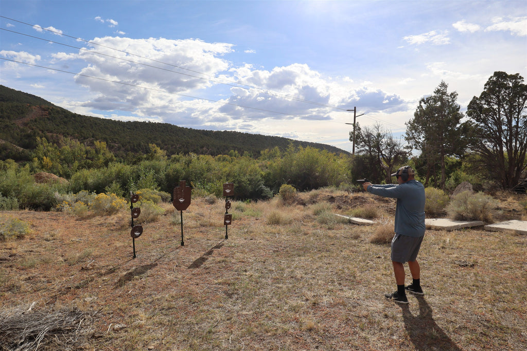 Wide view of a shooter at a range of Wyatt AR500 steel targets
