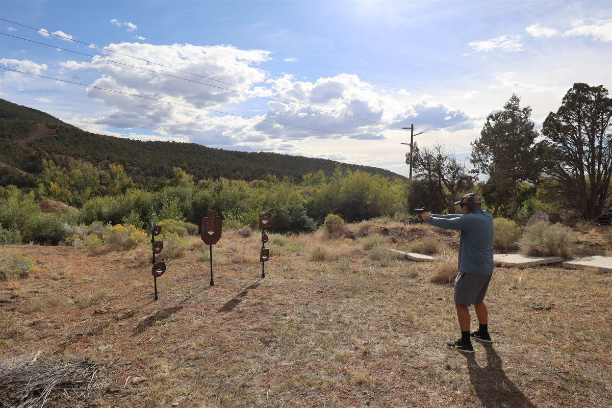 Wide view of a shooter at a range of Wyatt AR500 steel targets