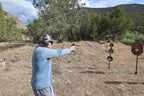Shooter firing at Wyatt AR500 steel targets at the range
