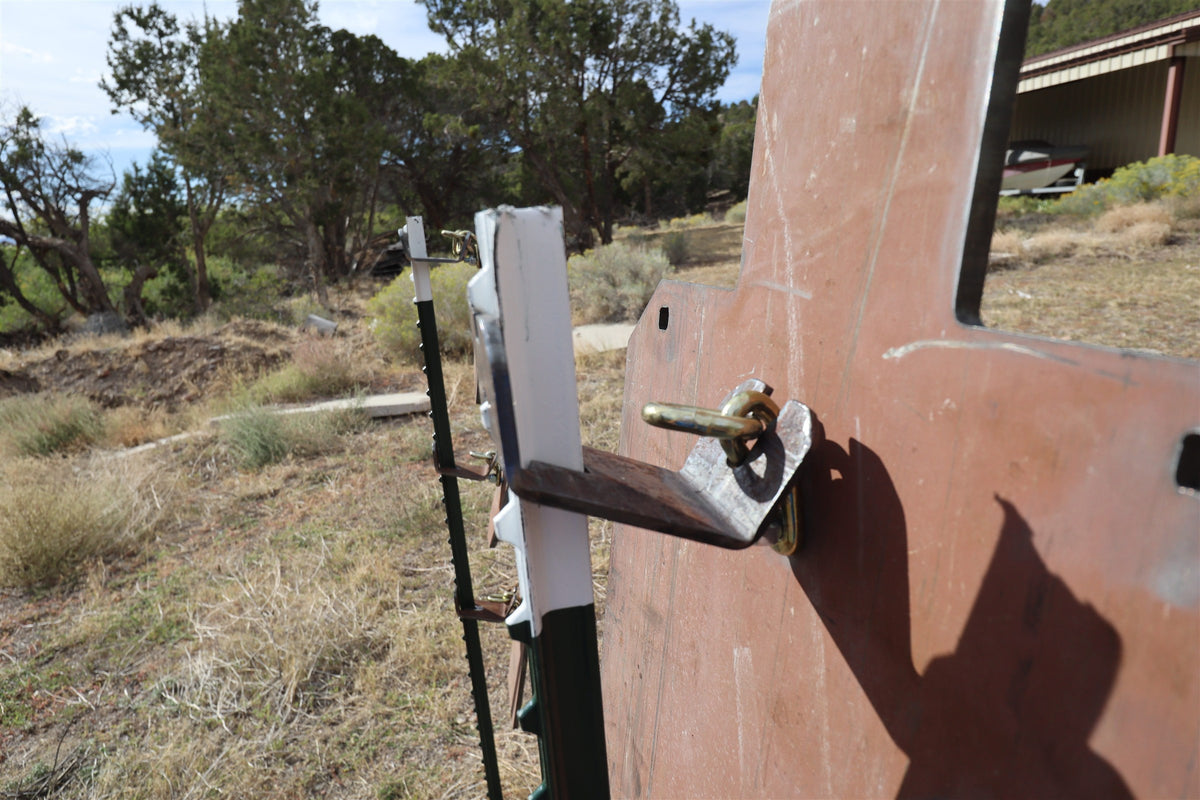 Real-life example: the back of a target bolted to a 3-link chain on the Wyatt T-post hanger system
