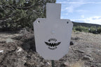 66-percent IPSC silhouette, 1/2-inch AR500 steel, white paint, three 9/16-inch square mounting holes, mounted on a T-post