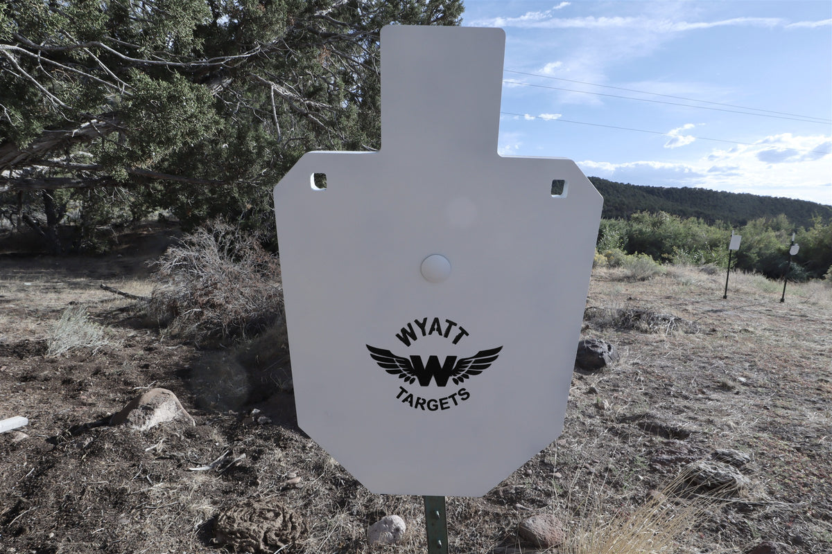 66-percent IPSC silhouette, 1/2-inch AR500 steel, white paint, three 9/16-inch square mounting holes, mounted on a T-post