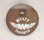 Real photo: 4″ 1/2″ AR500 steel gong, unpainted surface-rust finish with a white Wyatt Targets logo