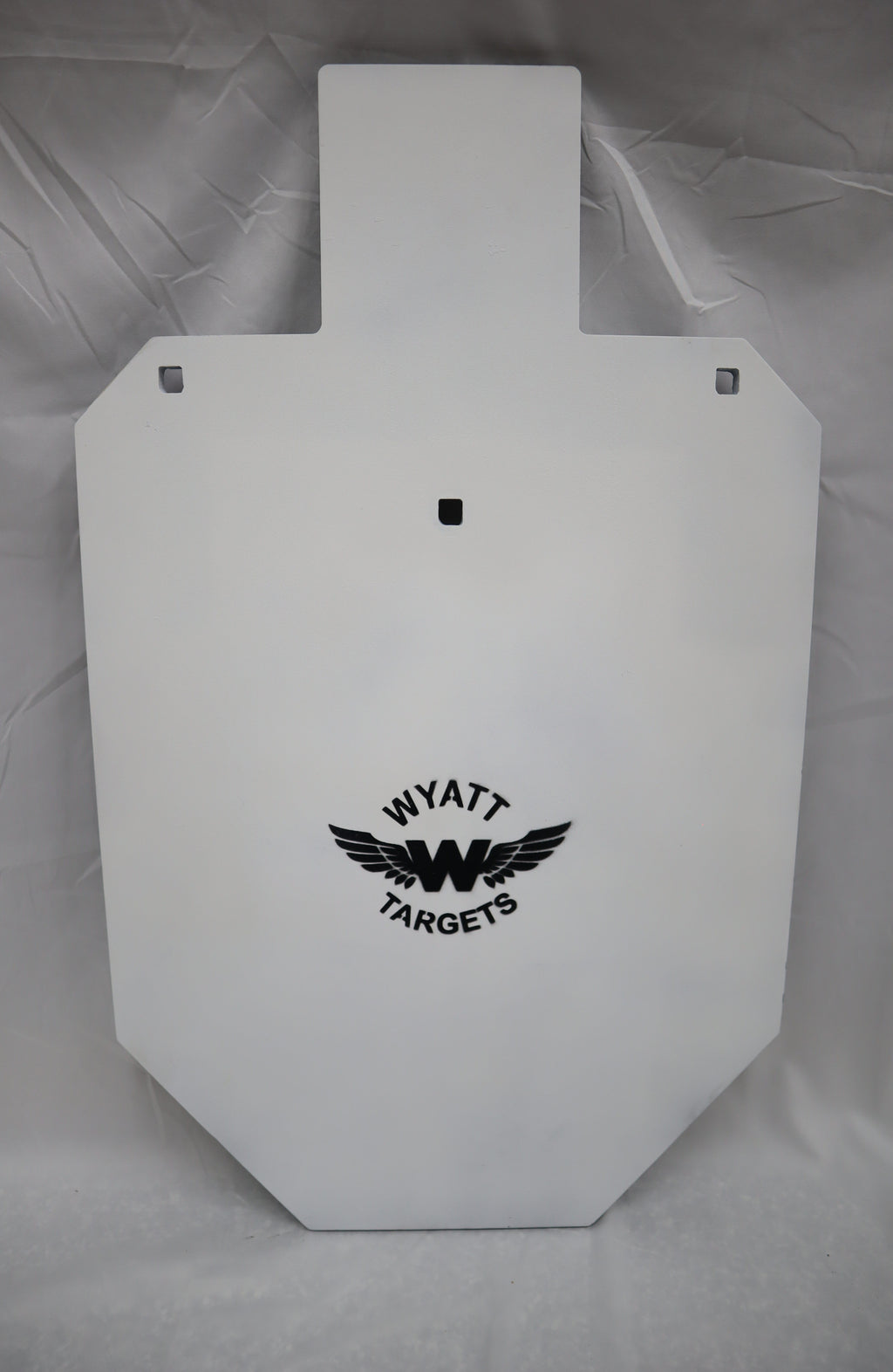 Real photo: full-size IPSC 1/2″ AR500 steel silhouette, white paint with the Wyatt Targets logo