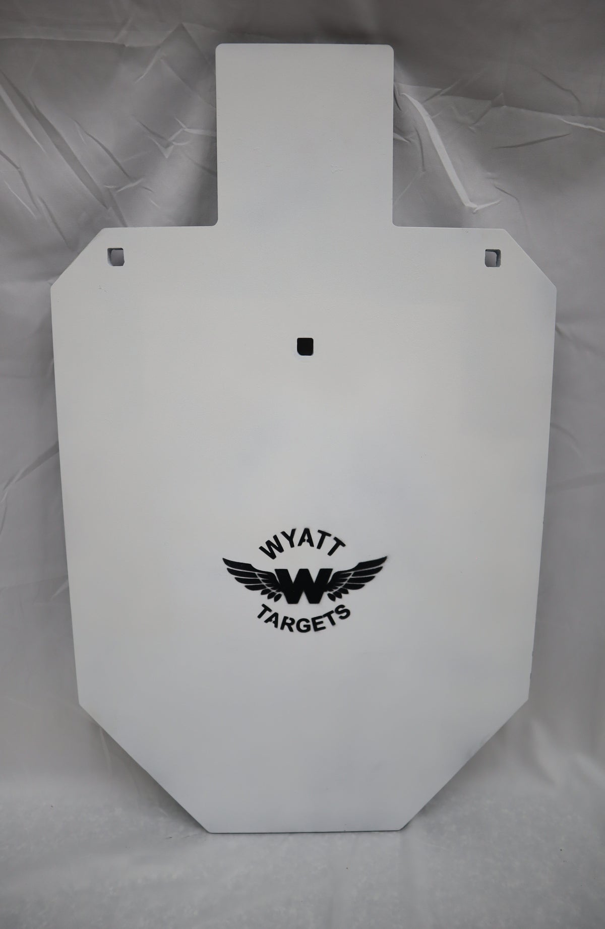 Real photo: full-size IPSC 1/2″ AR500 steel silhouette, white paint with the Wyatt Targets logo