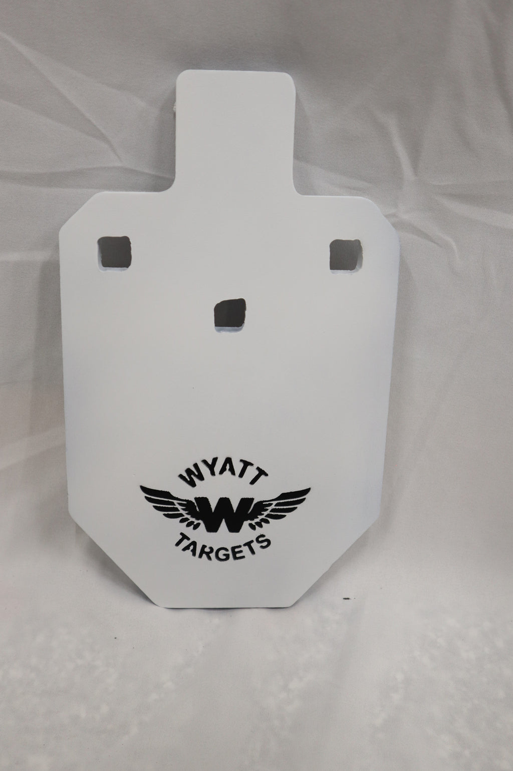 Real photo: IPSC 33% 1/2″ AR500 steel silhouette, white paint with the Wyatt Targets logo